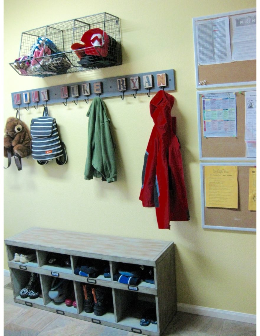  A mudroom that reflects organizing effort. There are cubbies and hooks for everything.