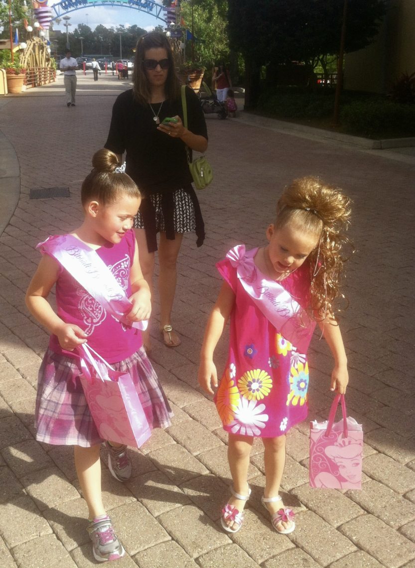 Little girls dressed up in Disneyworld