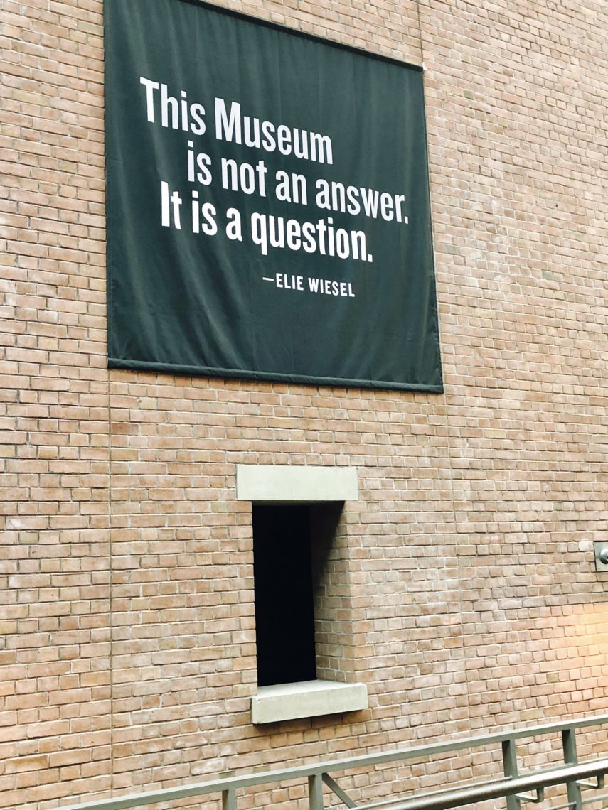 A banner saying "This Museum is not answer. It is a question." - Elie Weisel